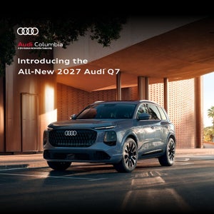 Side view of an Audi Q7 parked.